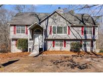 Charming home features a two-story design with a well-manicured front yard at 4276 Laurel Glen Ct, Douglasville, GA 30135