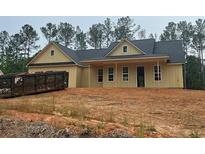 Charming, new construction, one-story home with vertical siding and dark roof in wooded setting at 554 Presley Farm Pkwy, Rockmart, GA 30153