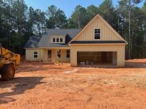 Charming new construction home featuring a two-car garage and unfinished yard at 642 Presley Farm Pkwy, Rockmart, GA 30153