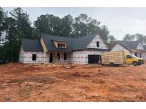 New construction exterior view with a delivery truck parked outside at 642 Presley Farm Pkwy, Rockmart, GA 30153