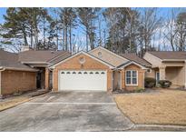 Charming brick home with a well-maintained front yard and a two-car garage at 4203 Jordans Bank, Union City, GA 30291