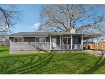 Charming single-story home features a carport, covered porch, and well-maintained lawn at 401 Cabriolet Ct, Mcdonough, GA 30253