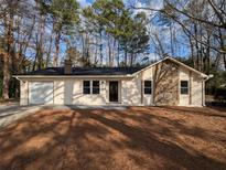 Charming renovated ranch home with stone accent and covered front entry at 8168 Spring Ct, Riverdale, GA 30274