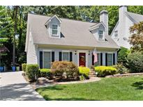 Charming home with a well-manicured lawn and inviting landscaping at 993 Seaboard Nw Ave, Atlanta, GA 30318