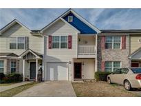 Charming townhome featuring a garage, quaint balcony, and lovely curb appeal at 1769 Old Dogwood, Jonesboro, GA 30238