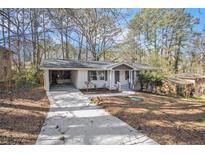 Charming one-story home featuring a well-maintained front yard and a convenient carport at 2695 Terratim Ln, Decatur, GA 30034