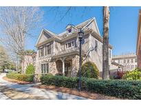 Charming two-story home featuring stone accents and a manicured front yard at 3529 S Sherwood Se Rd, Smyrna, GA 30082