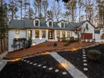 Charming exterior of a well-maintained home, with a landscaped yard and inviting entrance at 6260 River Overlook Dr, Atlanta, GA 30328