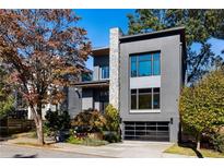 Contemporary two-story home with stone accents and a black garage door at 640 East Ne Ave, Atlanta, GA 30312