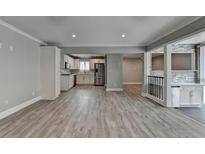 Bright open-concept kitchen featuring white cabinets, stainless steel appliances, and sleek, modern finishes at 346 Carpenter Dr # 29, Atlanta, GA 30328