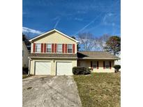 Charming two-story home features a two-car garage and traditional curb appeal at 6396 Phillips Ct, Lithonia, GA 30058