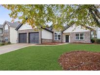 Charming single-Gathering home with a well-manicured lawn and a two-car garage at 100 Jericho Dr, Covington, GA 30016