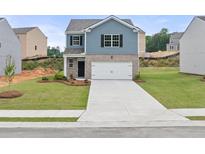 Charming two-story home with a well-manicured lawn and inviting curb appeal at 206 Oak View Ln, Dallas, GA 30157