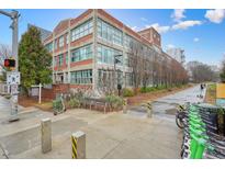 Striking brick exterior featuring large windows, a walkway and convenient scooter rentals at 890 Memorial Se Dr # 102, Atlanta, GA 30316