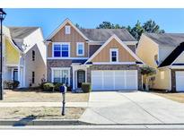 Charming two-story home with brick accents and a well-maintained front yard at 2157 Staunton Dr, Duluth, GA 30096