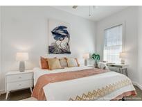 Bright bedroom featuring white walls, stylish decor, and a comfortable bed with decorative pillows at 680 Greenwood Ne Ave # 202, Atlanta, GA 30306