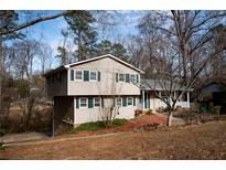 Charming two-story home with siding, a well-manicured lawn, and a classic, inviting facade at 940 Highview Se Dr, Smyrna, GA 30082