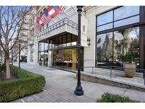 Stately building entrance with an awning and visible street-level landscaping at 2233 Peachtree Ne Rd # 402, Atlanta, GA 30309