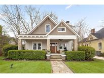 Charming craftsman home featuring stone accents, a covered porch, and beautifully landscaped front yard at 205 Mead Rd, Decatur, GA 30030