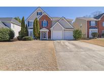 Charming two-story home with brick accents and a two-car garage at 3624 Bancroft Main Nw, Kennesaw, GA 30144