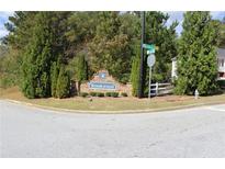 The community entrance to Brookwood is marked by a brick sign surrounded by mature landscaping at 200 Brookwood Xing, Douglasville, GA 30134