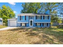 Charming two-story home with a well-maintained front yard, attached garage, and inviting curb appeal at 5399 Kristian Ct, Stone Mountain, GA 30088