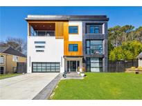 Modern home showcasing a three-story facade with mixed textures, large windows, and an attached garage at 1812 Hunters Gln, Marietta, GA 30062