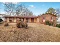 Charming brick home featuring a well-maintained lawn and inviting curb appeal at 2165 Sterling Ridge Rd, Decatur, GA 30032