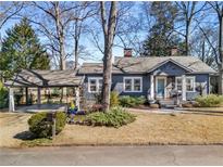 Charming bungalow with welcoming front porch, carport, and tasteful landscaping at 310 Allendale Se Dr, Atlanta, GA 30317