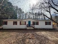 Charming single-story home featuring vinyl siding and a lovely front porch at 4911 Pickys Se Holw, Acworth, GA 30102