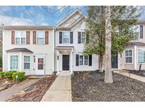 Charming townhouse with a well-maintained lawn and classic architectural details at 745 Crestwell Sw Cir, Atlanta, GA 30331
