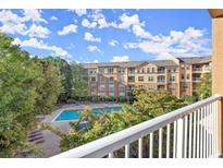 A beautiful view of the community pool and landscaping from a private balcony at 10 Perimeter Summit Ne Blvd # 4312, Atlanta, GA 30319