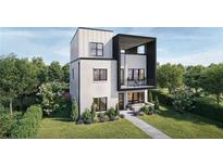 Modern two-story home featuring a balcony and contemporary design elements, set in a beautifully landscaped yard at 326 Treble Way, Alpharetta, GA 30009