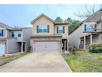 Charming two-story home with a two-car garage and well-maintained landscaping at 5460 Union Hill Ct, Union City, GA 30291