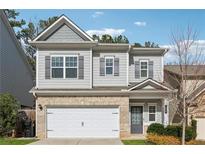 Charming two-story home with a brick and siding exterior and a two-car garage at 103 Bryon Ln, Acworth, GA 30102