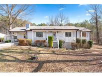 Charming single-story home featuring a welcoming front porch and well-maintained landscaping at 1095 Dallas Nebo Rd, Dallas, GA 30157