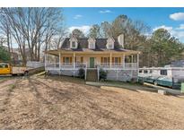 Charming home with a large covered front porch, perfect for relaxing and enjoying the outdoors at 41 Summer Glen Way, Dallas, GA 30157