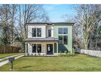 Charming two-story home with well-manicured lawn and a mix of modern design and classic elements at 1273 Danner Se St, Atlanta, GA 30316