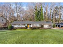 Charming single story home with manicured lawn and mature trees at 2346 Henderson Mill Ne Ct, Atlanta, GA 30345