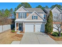 Charming two-story home with a two-car garage and stylish stone and siding facade at 3606 Elkhorn Nw Ct, Duluth, GA 30096