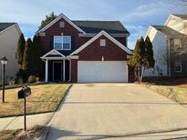 Charming two-story brick home with well-manicured lawn and a two-car garage at 1195 Se Stony Pt, Grayson, GA 30017