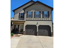 Charming two-story home featuring a two-car garage and welcoming front porch at 2761 Trebek Ct, Mcdonough, GA 30253