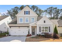 Charming two-story home features a two-car garage, grey siding and black shutters at 1078 Amarose Ln, Marietta, GA 30066