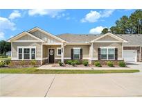 Charming one-story home with neutral siding, an inviting entrance and a well-manicured lawn at 3901 Shelleydale Dr, Powder Springs, GA 30127