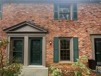 Charming brick townhouse featuring two entry doors and symmetrical window placement at 3085 Colonial Way # G, Atlanta, GA 30341