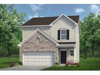 Two-story home with stone and siding, an attached two-car garage, and a well-maintained front lawn at 735 Shetland Trl, Cartersville, GA 30121