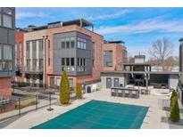 Modern brick townhome featuring a community pool and outdoor bar, perfect for entertaining at 1226 Chelsea Nw Cir, Atlanta, GA 30318