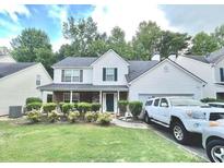 Inviting two-story home features a two-car garage and meticulously maintained landscaping at 2782 Wynhaven Oaks Way, Lawrenceville, GA 30043