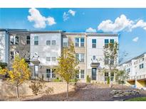 Modern townhome exterior showcasing a neatly landscaped front yard and contemporary architectural details on a sunny day at 2537 Astaire Ct, Atlanta, GA 30318