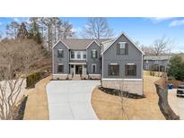 Beautiful exterior elevation of a modern home with a long driveway and manicured landscaping at 2517 Canopy Ct, Marietta, GA 30066